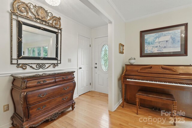 174 Sunny Knoll Ln, Boone, NC 28607 - foyer with light wood finished floors and crown molding