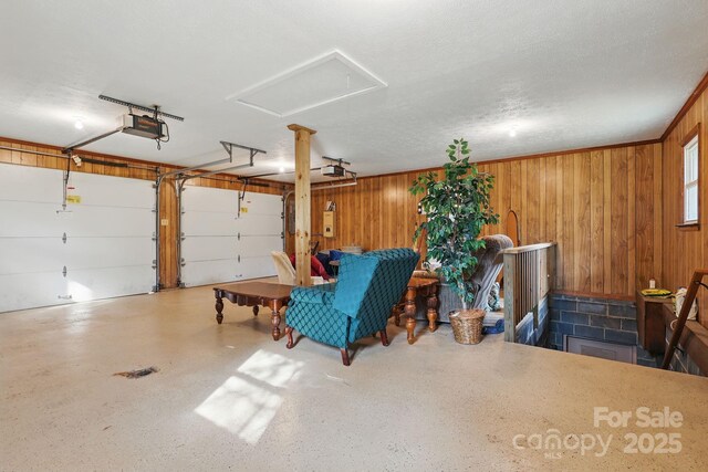 174 Sunny Knoll Ln, Boone, NC 28607 - garage with a garage door opener and wood walls
