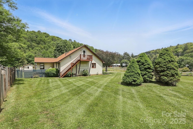 137 Clint Lewis Rd, Boone, NC 28607 - view of yard with stairs, a view of trees, and a wooden deck