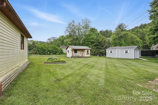 137 Clint Lewis Rd, Boone, NC 28607 - view of green lawn with an outbuilding