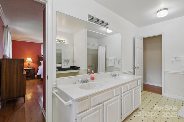 137 Clint Lewis Rd, Boone, NC 28607 - ensuite bathroom featuring double vanity, baseboards, and a shower with shower curtain