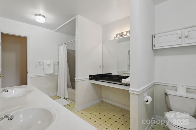137 Clint Lewis Rd, Boone, NC 28607 - full bathroom with toilet, double vanity, and baseboards
