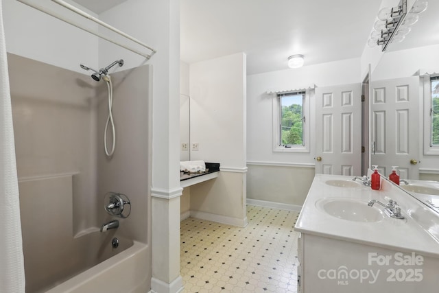 137 Clint Lewis Rd, Boone, NC 28607 - full bathroom featuring shower / tub combination, tile patterned floors, baseboards, and double vanity