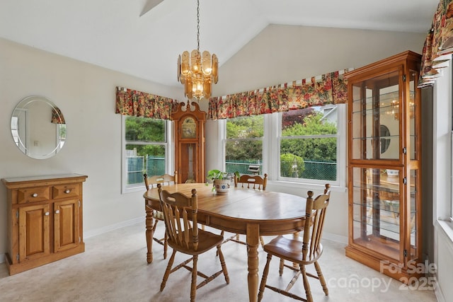 137 Clint Lewis Rd, Boone, NC 28607 - dining area with lofted ceiling, a chandelier, and baseboards