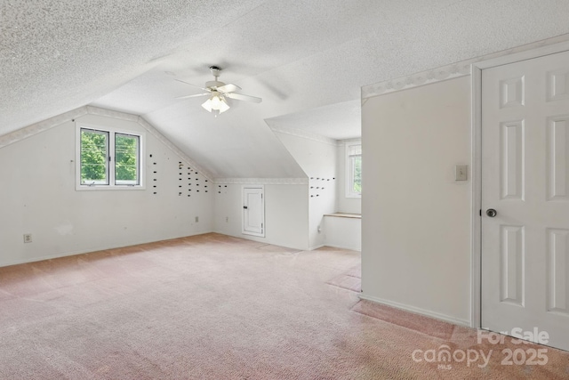 137 Clint Lewis Rd, Boone, NC 28607 - bonus room with ceiling fan, light carpet, a textured ceiling, lofted ceiling, and baseboards