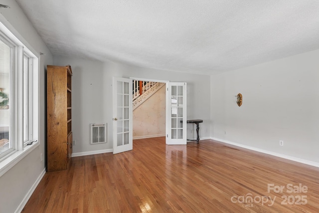 137 Clint Lewis Rd, Boone, NC 28607 - empty room featuring french doors, wood finished floors, and baseboards