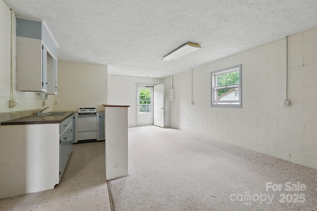 137 Clint Lewis Rd, Boone, NC 28607 - kitchen featuring white range with electric cooktop, a textured ceiling, and a sink