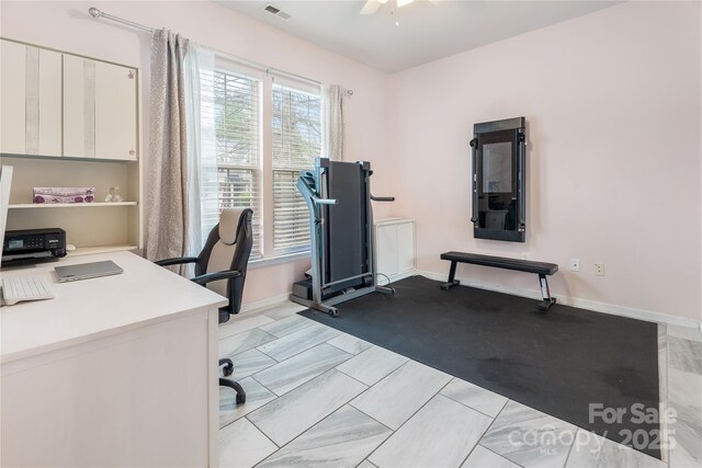 home office with baseboards, visible vents, and a ceiling fan