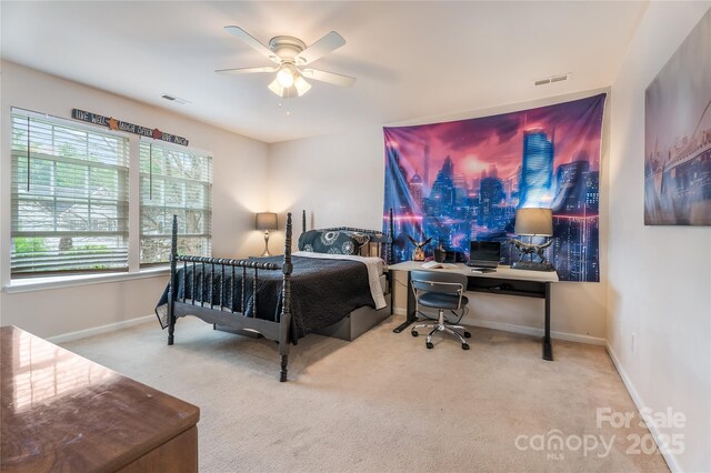 bedroom with carpet flooring, visible vents, and baseboards