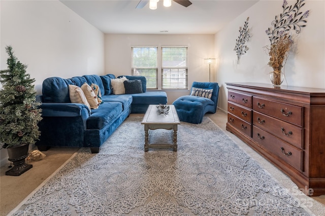 living room with light colored carpet and a ceiling fan