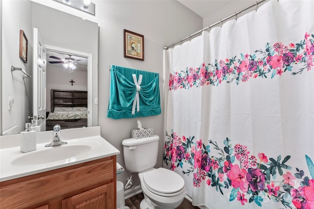 full bathroom with connected bathroom, ceiling fan, toilet, and vanity