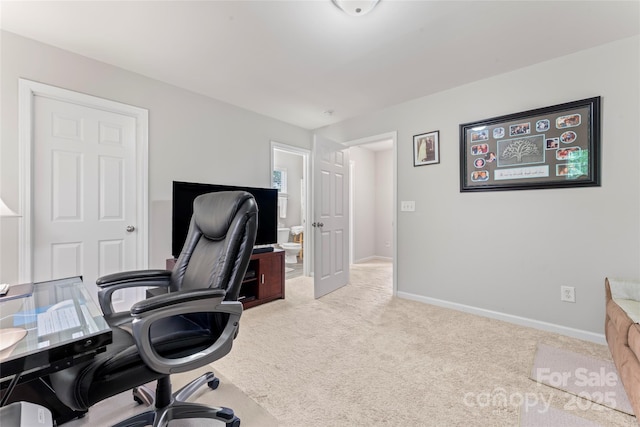 office space featuring carpet flooring and baseboards