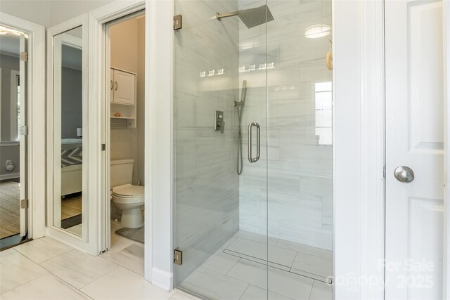 8428 Westmoreland Lake Dr, Cornelius, NC 28031 - full bath featuring tile patterned floors, a stall shower, and toilet