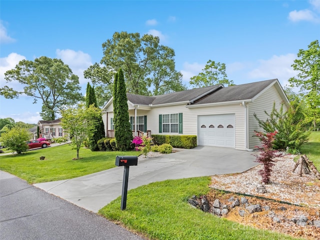 single story home featuring a garage, driveway, and a front yard