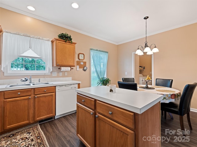 kitchen with dishwasher, a sink, dark wood-type flooring, a chandelier, and crown molding