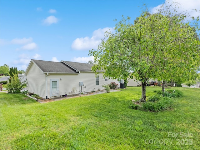 back of property with a yard