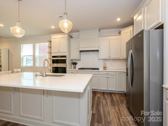 1516 Laggan Ln, Indian Trail, NC 28079 - kitchen featuring a sink, stainless steel appliances, visible vents, light countertops, and ornamental molding