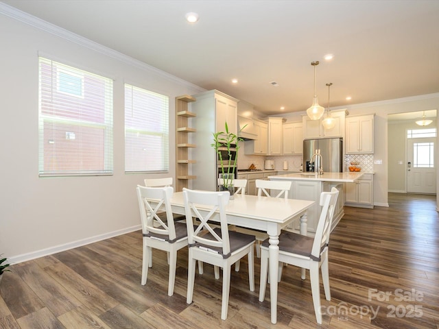 1516 Laggan Ln, Indian Trail, NC 28079 - dining space with dark wood-style flooring, ornamental molding, baseboards, and recessed lighting