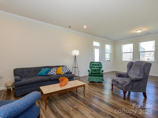 1516 Laggan Ln, Indian Trail, NC 28079 - living room featuring ornamental molding, baseboards, visible vents, and wood finished floors
