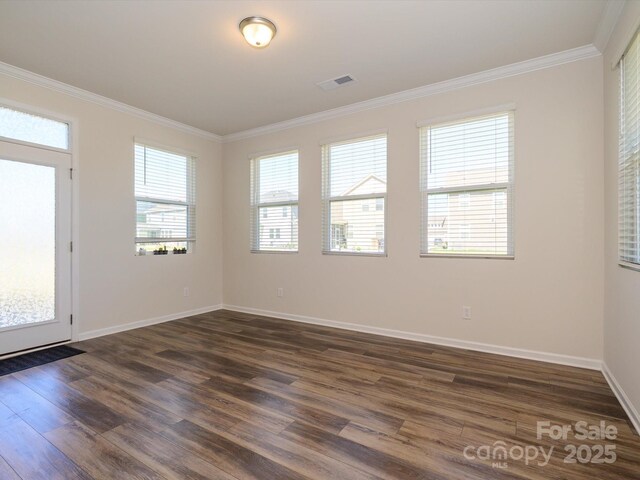 1516 Laggan Ln, Indian Trail, NC 28079 - empty room with dark wood finished floors, visible vents, baseboards, and ornamental molding