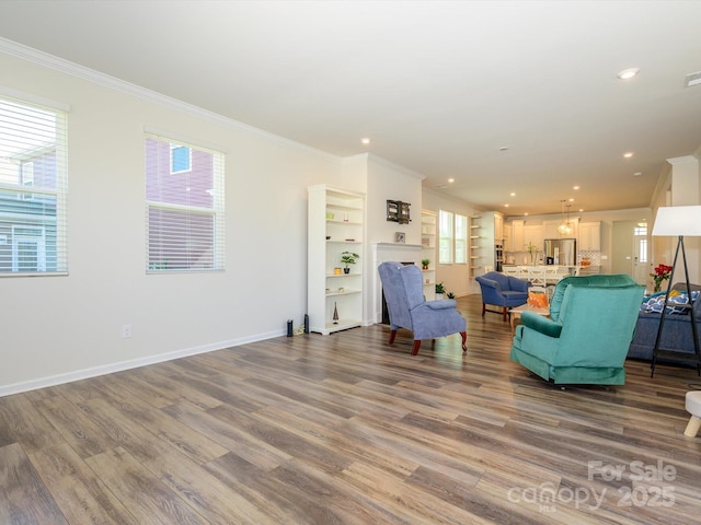1516 Laggan Ln, Indian Trail, NC 28079 - living area featuring ornamental molding, recessed lighting, and wood finished floors