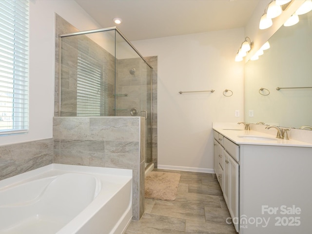 1516 Laggan Ln, Indian Trail, NC 28079 - bathroom with double vanity, a garden tub, a shower stall, and a sink