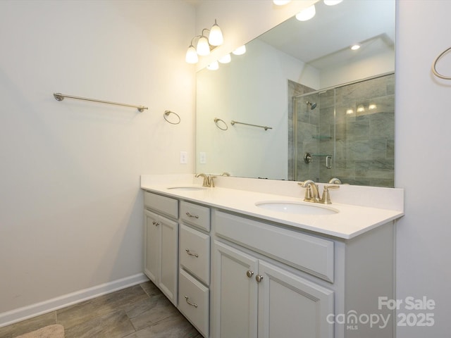 1516 Laggan Ln, Indian Trail, NC 28079 - bathroom with a stall shower, baseboards, double vanity, and a sink