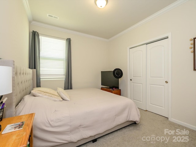 1516 Laggan Ln, Indian Trail, NC 28079 - carpeted bedroom with baseboards, ornamental molding, a closet, and visible vents