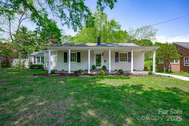 402 Hudson St, Winnsboro, SC 29180 - view of front of property with crawl space, a front lawn, covered porch, and fence