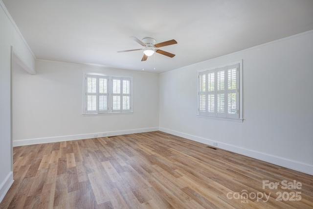 402 Hudson St, Winnsboro, SC 29180 - empty room featuring visible vents, ornamental molding, light wood-style floors, baseboards, and ceiling fan