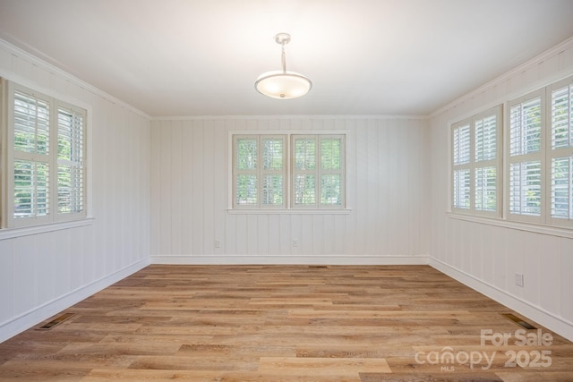 402 Hudson St, Winnsboro, SC 29180 - unfurnished room with ornamental molding, light wood-style floors, and visible vents