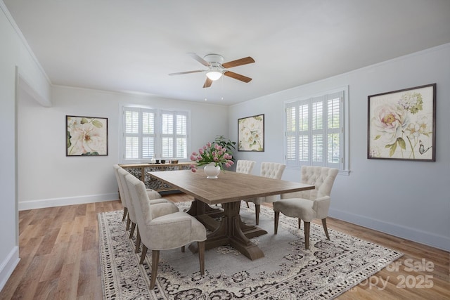 402 Hudson St, Winnsboro, SC 29180 - dining space with light wood-type flooring, ceiling fan, and ornamental molding