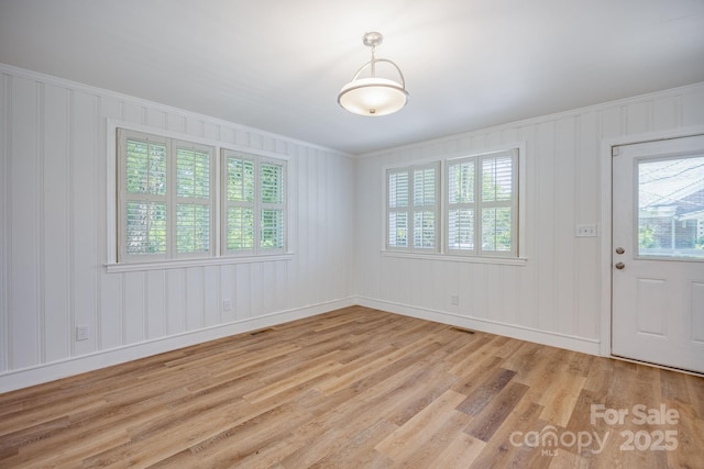 402 Hudson St, Winnsboro, SC 29180 - interior space featuring crown molding, light wood-style floors, and plenty of natural light