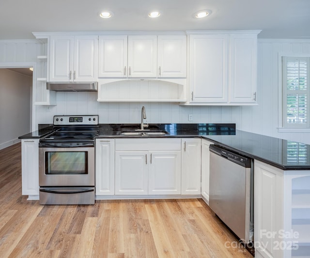 402 Hudson St, Winnsboro, SC 29180 - kitchen with white cabinets, stainless steel appliances, a sink, open shelves, and under cabinet range hood