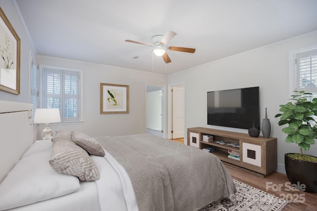 402 Hudson St, Winnsboro, SC 29180 - bedroom featuring a ceiling fan, crown molding, and wood finished floors