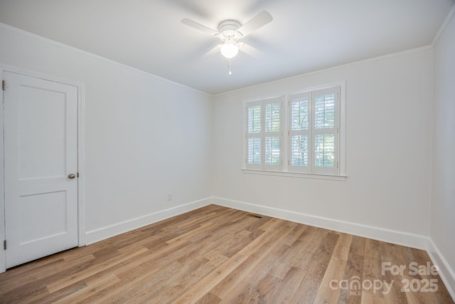 402 Hudson St, Winnsboro, SC 29180 - empty room with light wood-style floors, crown molding, baseboards, and a ceiling fan