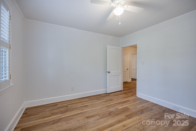 402 Hudson St, Winnsboro, SC 29180 - spare room with ceiling fan, baseboards, ornamental molding, and light wood finished floors