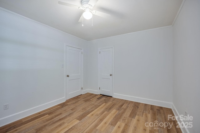 402 Hudson St, Winnsboro, SC 29180 - empty room featuring ceiling fan, baseboards, crown molding, and light wood-type flooring