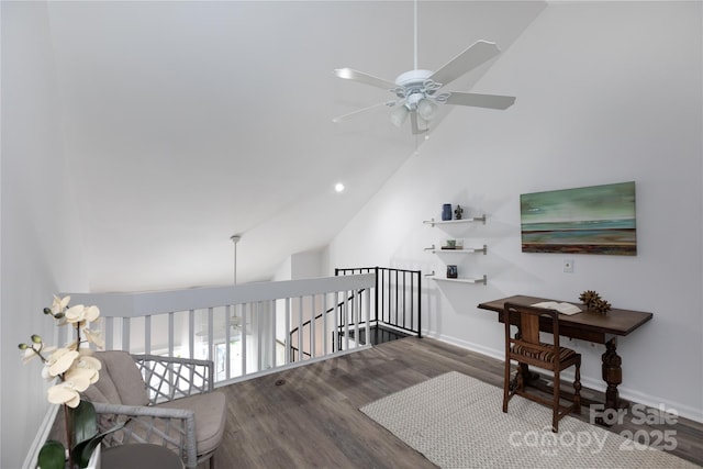 bonus room featuring vaulted ceiling, a ceiling fan, wood finished floors, and baseboards
