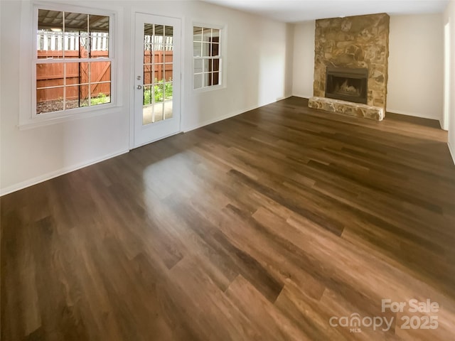 8026 Regent Park Ln, Charlotte, NC 28210 - unfurnished living room with dark wood-style floors, a fireplace, and baseboards