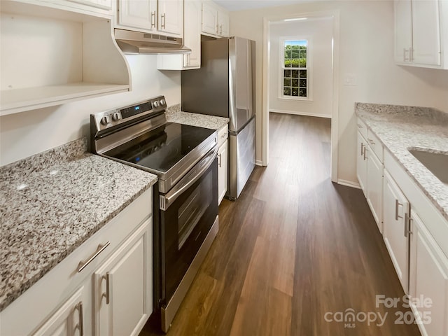 8026 Regent Park Ln, Charlotte, NC 28210 - kitchen with under cabinet range hood, stainless steel appliances, dark wood-style flooring, white cabinets, and light stone counters