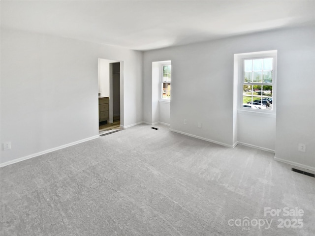 8026 Regent Park Ln, Charlotte, NC 28210 - carpeted spare room with baseboards