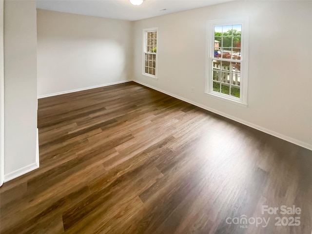8026 Regent Park Ln, Charlotte, NC 28210 - empty room with dark wood-type flooring and baseboards