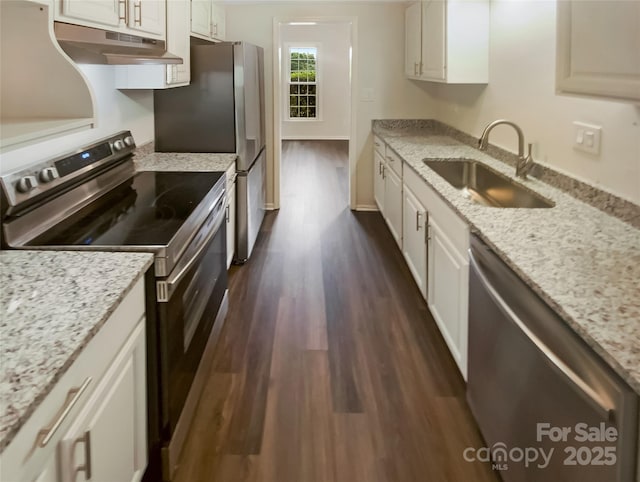 8026 Regent Park Ln, Charlotte, NC 28210 - kitchen with stainless steel appliances, a sink, under cabinet range hood, dark wood-style floors, and white cabinets