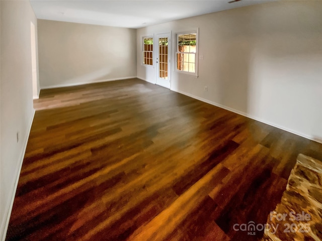 8026 Regent Park Ln, Charlotte, NC 28210 - empty room featuring baseboards and dark wood finished floors