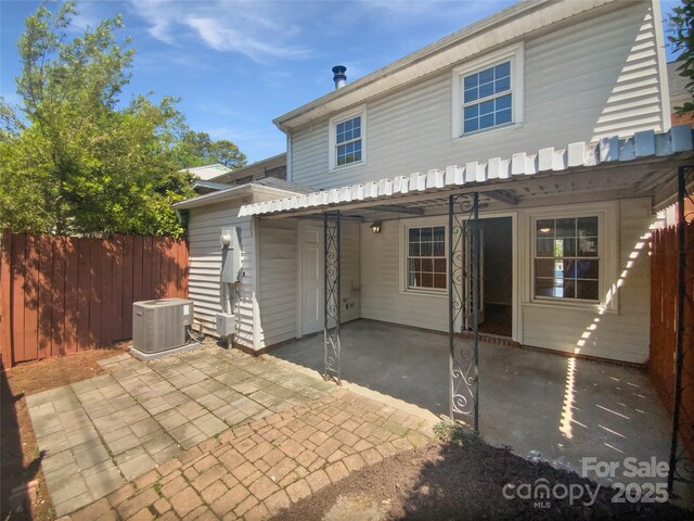 8026 Regent Park Ln, Charlotte, NC 28210 - rear view of property featuring cooling unit and a patio area