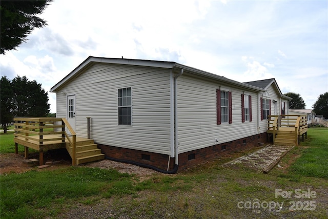 234 Olin Loop, Olin, NC 28660 - view of side of home with crawl space and a deck