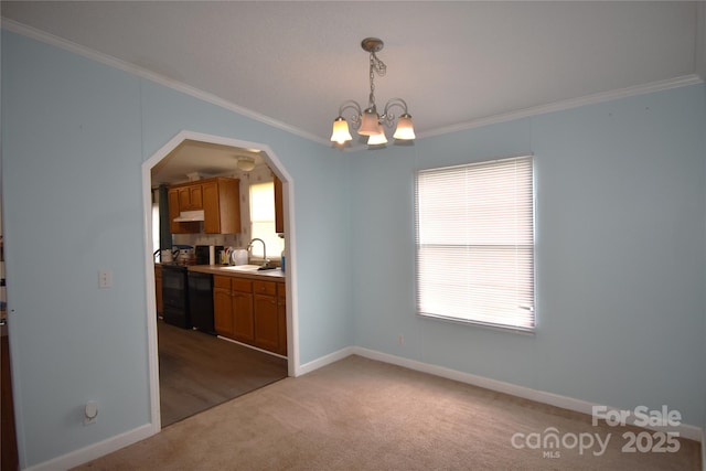 234 Olin Loop, Olin, NC 28660 - unfurnished dining area with ornamental molding, light colored carpet, arched walkways, and a chandelier