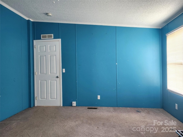 234 Olin Loop, Olin, NC 28660 - carpeted empty room featuring a textured ceiling, a decorative wall, and crown molding