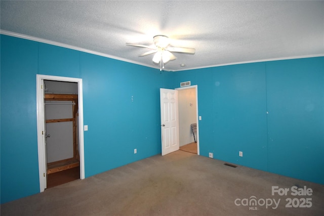 234 Olin Loop, Olin, NC 28660 - unfurnished bedroom with ornamental molding, a textured ceiling, carpet floors, and ceiling fan